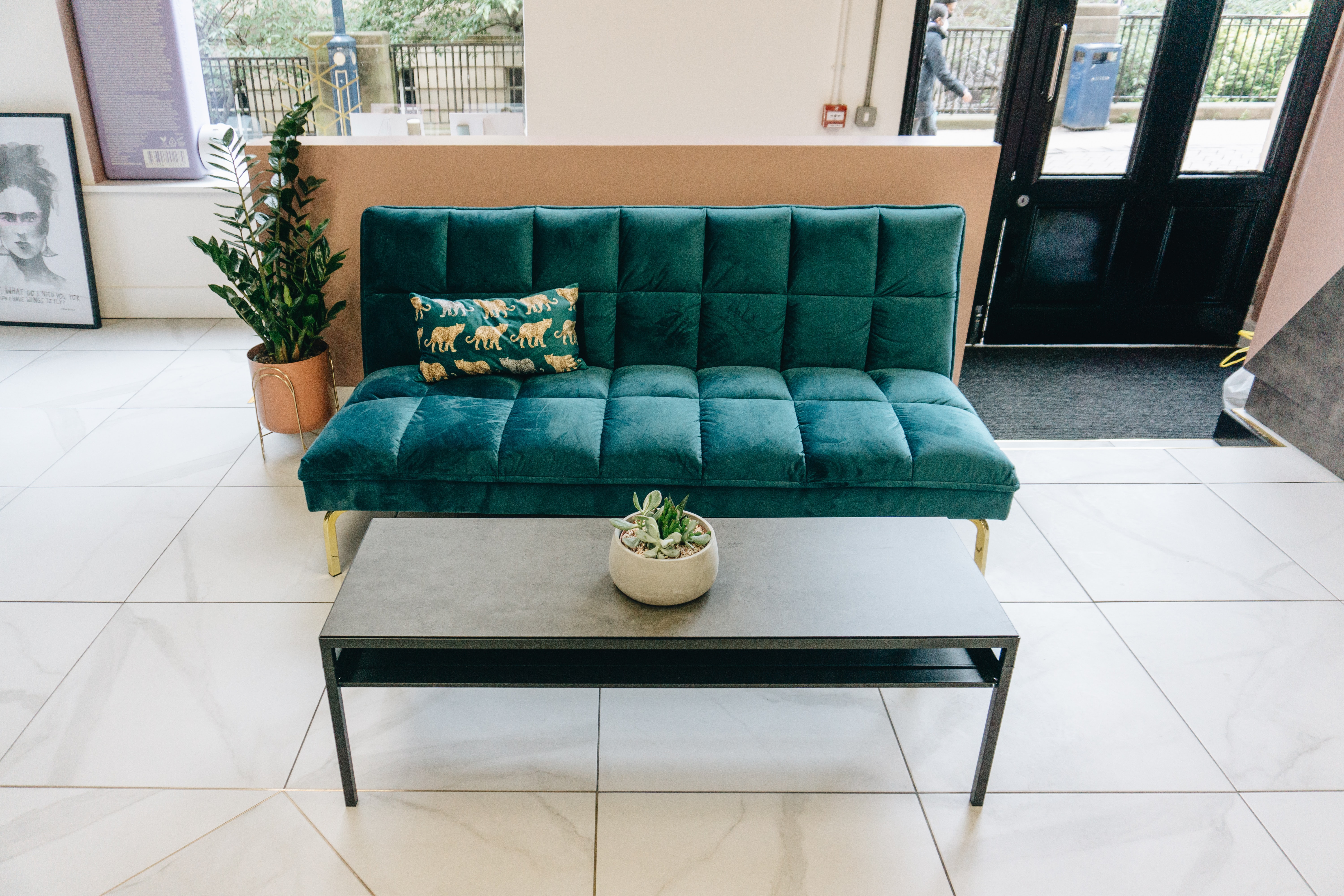 Waiting area with green couch